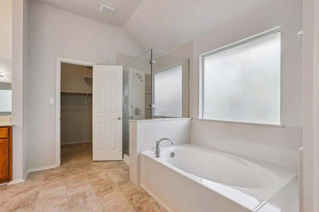 411 S Lynnwood Trl, Cedar Park, TX 78613 - full bath featuring a stall shower, a garden tub, lofted ceiling, vanity, and a walk in closet