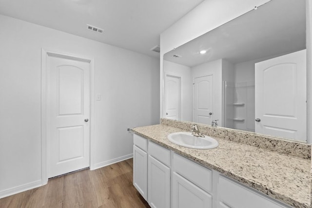 440 Aplite Pass, Maxwell, TX 78656 - bathroom with vanity and wood finished floors