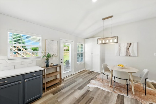 118 W Pauwela Ln, Bastrop, TX 78602 - dining room featuring lofted ceiling and light wood-style flooring