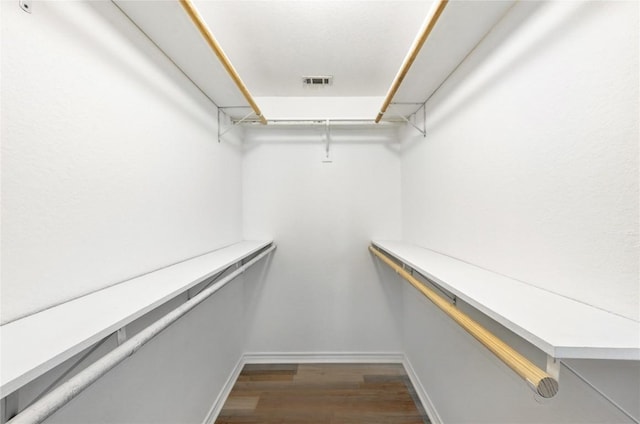 118 W Pauwela Ln, Bastrop, TX 78602 - spacious closet with dark wood finished floors