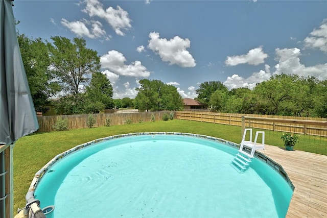 118 W Pauwela Ln, Bastrop, TX 78602 - view of swimming pool with a deck and a fenced backyard