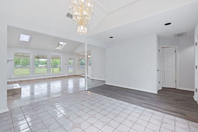 11511 Sombrero Dr, Austin, TX 78748 - empty room with light tile patterned floors, lofted ceiling, a chandelier, and ceiling fan