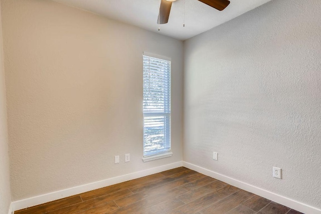 5808 Cherry Park, Austin, TX 78745 - spare room featuring dark wood-style flooring, a ceiling fan, and a textured wall