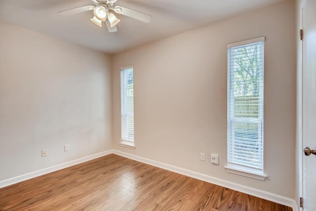 5808 Cherry Park, Austin, TX 78745 - empty room with ceiling fan and wood finished floors