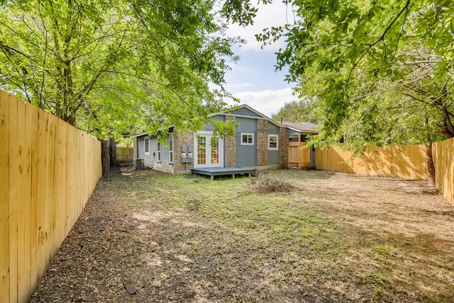 5808 Cherry Park, Austin, TX 78745 - fenced backyard with french doors and a wooden deck