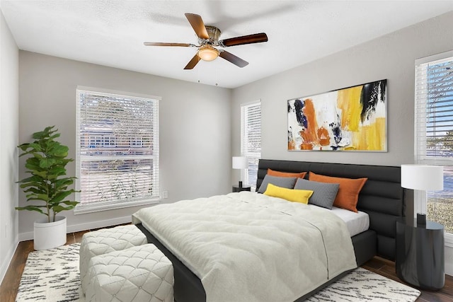 5808 Cherry Park, Austin, TX 78745 - bedroom with wood finished floors and a ceiling fan