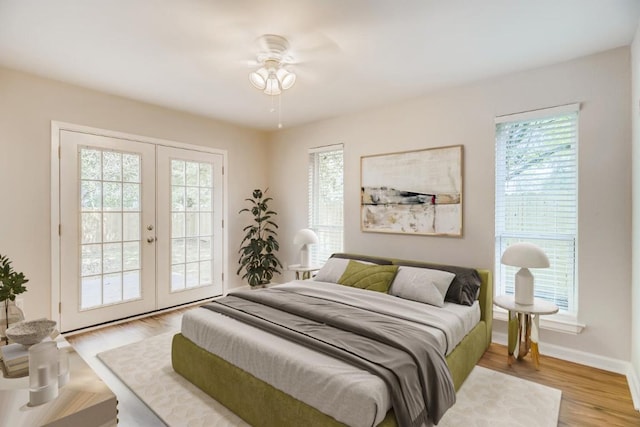 5808 Cherry Park, Austin, TX 78745 - bedroom with french doors, access to outside, and wood finished floors