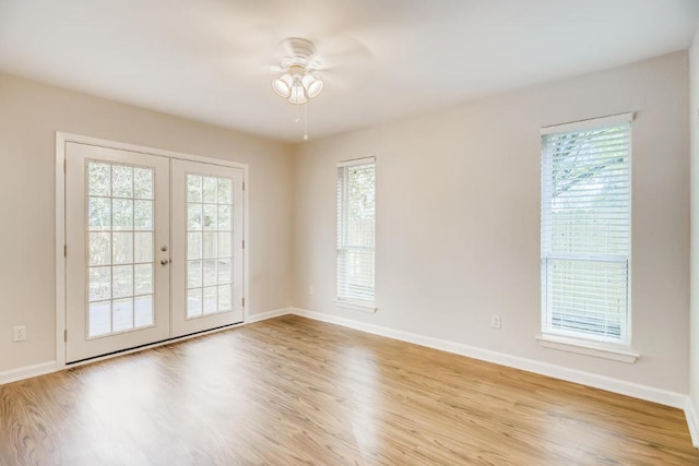5808 Cherry Park, Austin, TX 78745 - unfurnished room with french doors, healthy amount of natural light, and wood finished floors