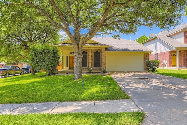 2628 Bolton St, Austin, TX 78748 - view of front of house with a garage, a front lawn, brick siding, and driveway
