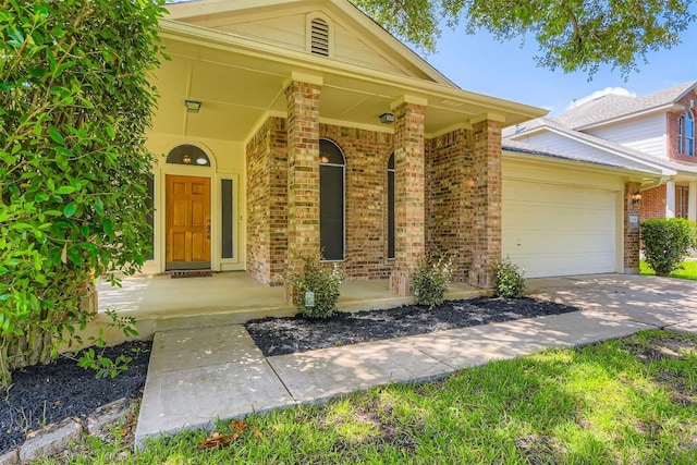2628 Bolton St, Austin, TX 78748 - view of front of home featuring brick siding, covered porch, an attached garage, and concrete driveway