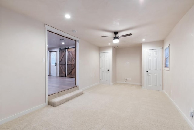 318 W Hackberry St, Fredericksburg, TX 78624 - spare room featuring a barn door, light colored carpet, recessed lighting, and ceiling fan