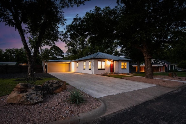 318 W Hackberry St, Fredericksburg, TX 78624 - view of front facade featuring driveway and an attached garage