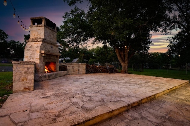 318 W Hackberry St, Fredericksburg, TX 78624 - view of patio / terrace featuring an outdoor stone fireplace