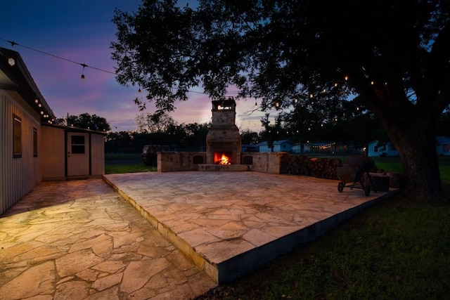 318 W Hackberry St, Fredericksburg, TX 78624 - view of patio with an outdoor stone fireplace