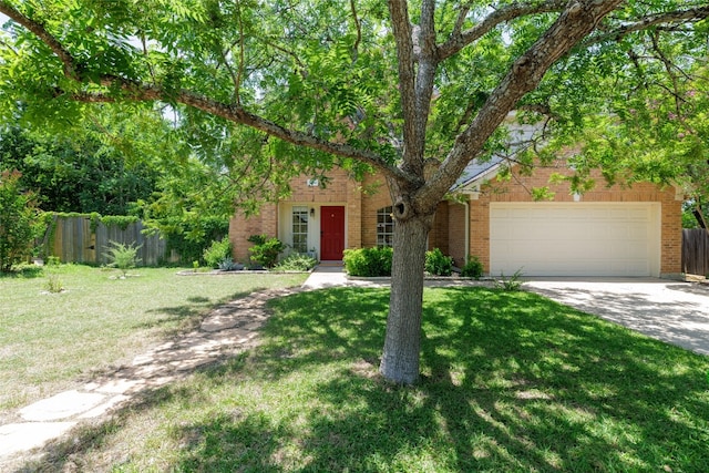 16704 Shipshaw River Cv, Leander, TX 78641 - obstructed view of property with brick siding, driveway, and a garage