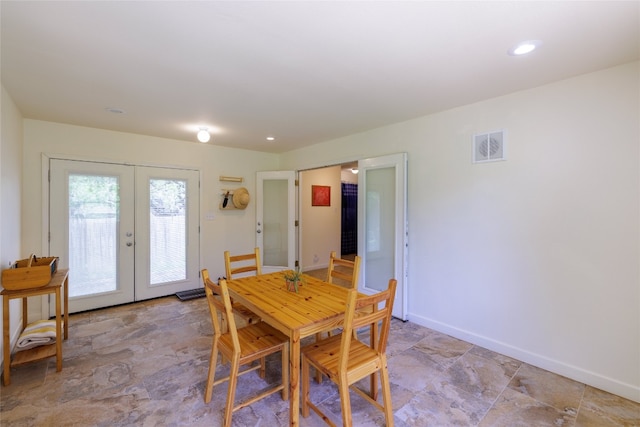 16704 Shipshaw River Cv, Leander, TX 78641 - dining room featuring french doors, stone finish floors, and recessed lighting