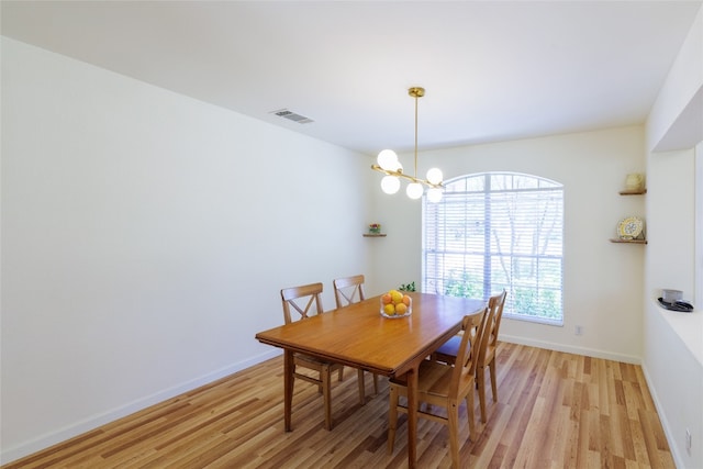 16704 Shipshaw River Cv, Leander, TX 78641 - dining room with light wood-style flooring and a chandelier