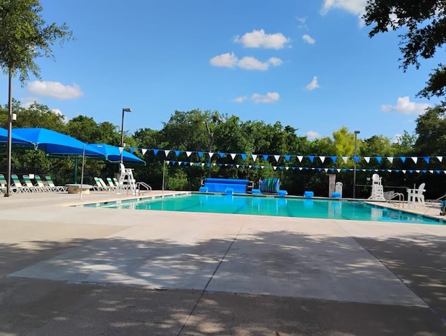16704 Shipshaw River Cv, Leander, TX 78641 - community pool with a patio area