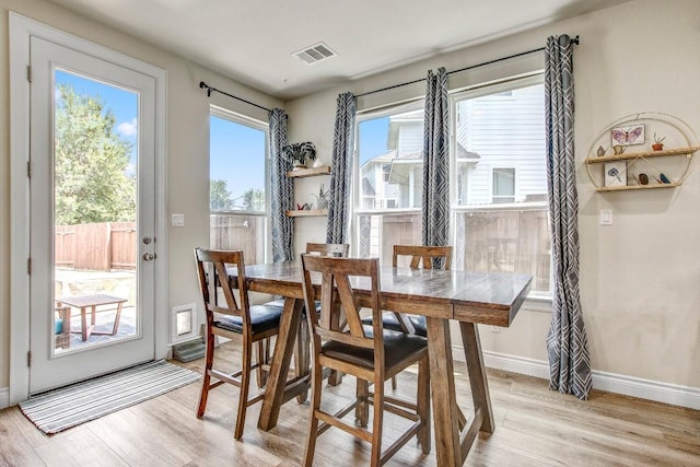 336 Gaida Loop, Georgetown, TX 78628 - dining room with light wood-style flooring and baseboards