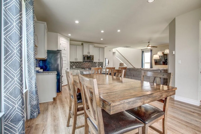 336 Gaida Loop, Georgetown, TX 78628 - dining space with light wood finished floors, stairs, a ceiling fan, and recessed lighting
