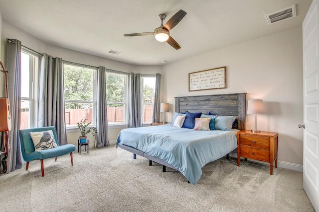 336 Gaida Loop, Georgetown, TX 78628 - bedroom with multiple windows, carpet floors, and a ceiling fan