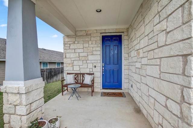 336 Gaida Loop, Georgetown, TX 78628 - view of exterior entry with stone siding and a porch