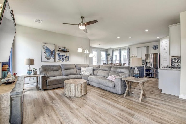 336 Gaida Loop, Georgetown, TX 78628 - living room with light wood finished floors, recessed lighting, and a ceiling fan