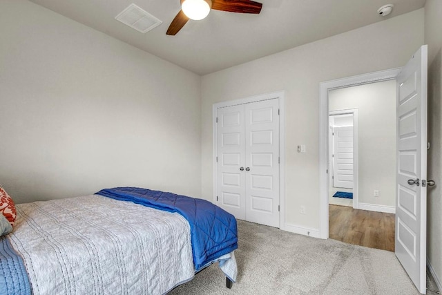 336 Gaida Loop, Georgetown, TX 78628 - bedroom featuring carpet, a ceiling fan, and a closet