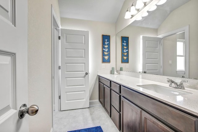 336 Gaida Loop, Georgetown, TX 78628 - bathroom featuring vanity, tile patterned flooring, and lofted ceiling