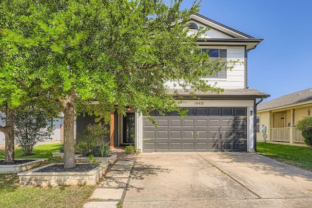 14418 Cummins Way, Manor, TX 78653 - view of front of property with concrete driveway and an attached garage