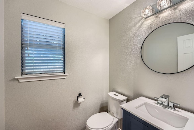 14418 Cummins Way, Manor, TX 78653 - half bath featuring vanity and a textured wall