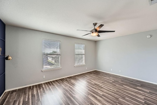 14418 Cummins Way, Manor, TX 78653 - spare room with wood finished floors and a ceiling fan