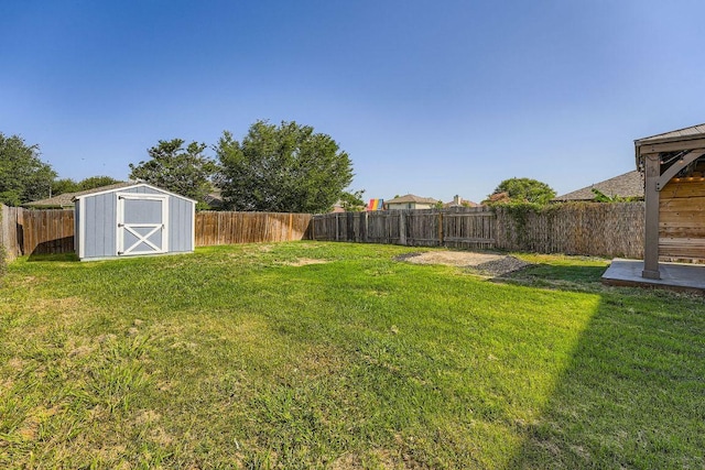 14418 Cummins Way, Manor, TX 78653 - fenced backyard with a storage unit