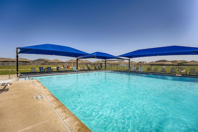 14418 Cummins Way, Manor, TX 78653 - community pool featuring a fenced backyard and a patio area