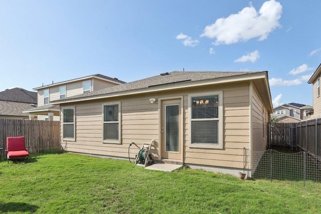 13605 Abigail Adams St, Manor, TX 78653 - rear view of property featuring a fenced backyard