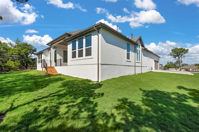 5126 Destination Way, Jonestown, TX 78645 - view of home's exterior featuring stucco siding and a lawn