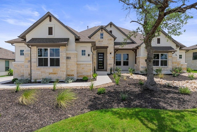 5126 Destination Way, Jonestown, TX 78645 - view of front of house with stone siding, a shingled roof, and stucco siding