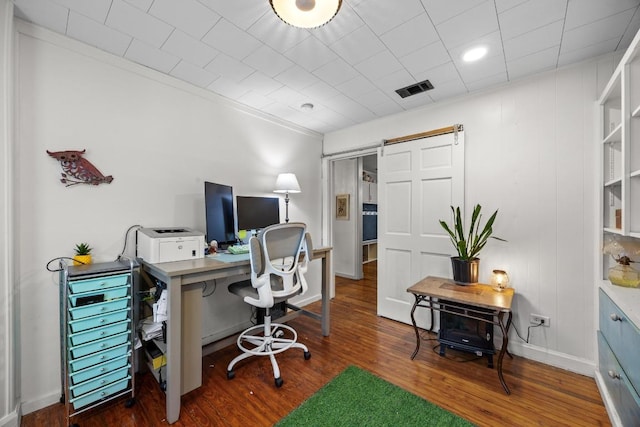 707 Wilson St, Taylor, TX 76574 - office with a barn door and wood finished floors