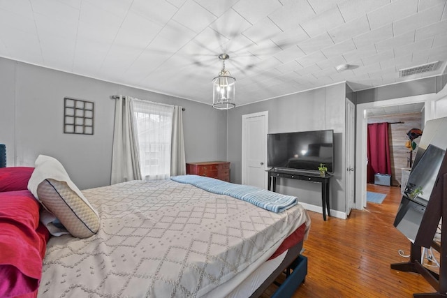 707 Wilson St, Taylor, TX 76574 - bedroom featuring wood finished floors