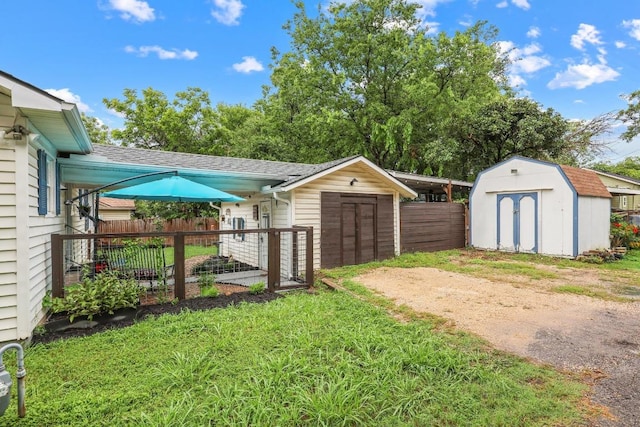 707 Wilson St, Taylor, TX 76574 - view of yard with a storage shed