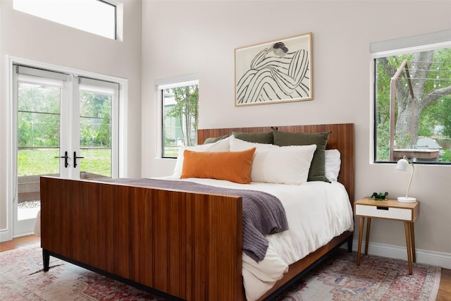 5710 Marilyn Dr, Austin, TX 78757 - bedroom with wood finished floors and access to exterior