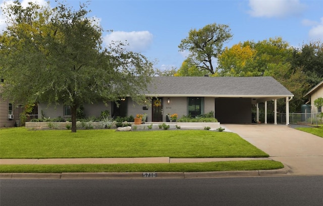 5710 Marilyn Dr, Austin, TX 78757 - ranch-style house with driveway and a carport