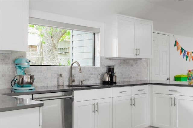 5710 Marilyn Dr, Austin, TX 78757 - kitchen featuring dishwasher, white cabinetry, and decorative backsplash