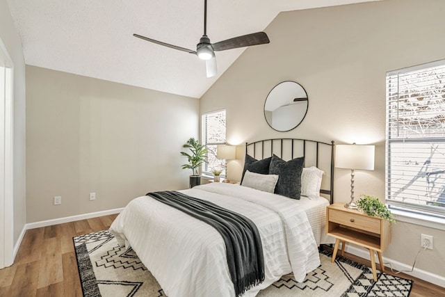 1411 Gracy Farms Ln Unit 130, Austin, TX 78758 - bedroom featuring light wood finished floors, ceiling fan, and high vaulted ceiling