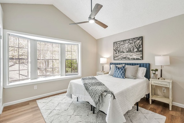 1411 Gracy Farms Ln Unit 130, Austin, TX 78758 - bedroom featuring vaulted ceiling, wood finished floors, and ceiling fan