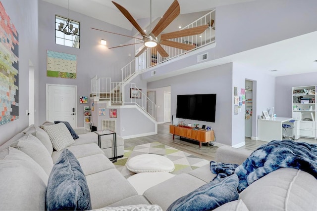 402 Oakcrest Dr, Cedar Park, TX 78613 - living room featuring a towering ceiling, light wood-type flooring, stairway, and ceiling fan