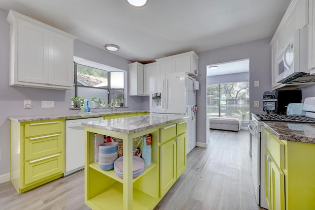 402 Oakcrest Dr, Cedar Park, TX 78613 - kitchen with white appliances, light wood finished floors, healthy amount of natural light, and white cabinets