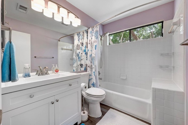 402 Oakcrest Dr, Cedar Park, TX 78613 - bathroom with shower / bath combo with shower curtain, vanity, and wood finished floors