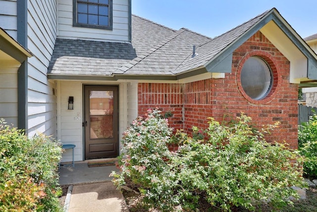 402 Oakcrest Dr, Cedar Park, TX 78613 - property entrance featuring roof with shingles and brick siding