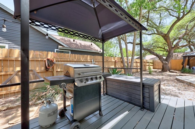 402 Oakcrest Dr, Cedar Park, TX 78613 - wooden deck with a fenced backyard and a grill